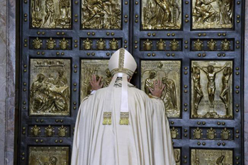 Pope Francis opens the Holy Doors.